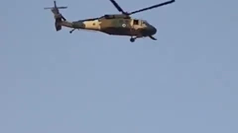 Taliban flying Blackhawk Helicopter over Kandahar