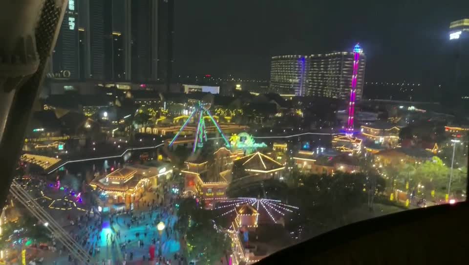 Looking down on the night view under the Ferris wheel