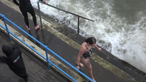 Swimmers on the Hoe Ocean City. New Years Day 2023