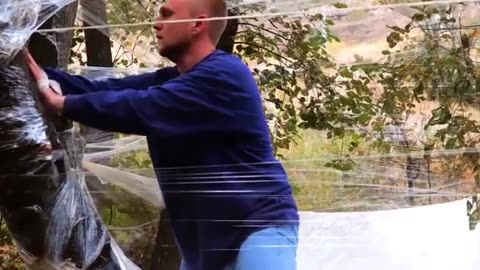 TEMPORARY SHELTER MADE WITH FOOD FILM TO SIT DOWN COMFORTABLY IN THE FOREST