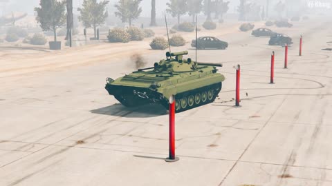 BMP-2 armored infantry vehicle practices moving over obstacles and firing weapons