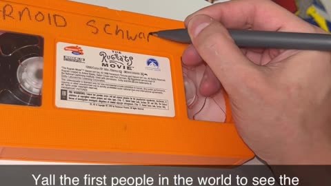 Writing Arnold Schwarneznegger’s name on a VHS copy of Rugrats the Movie