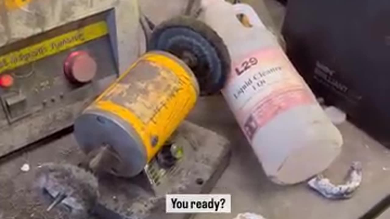 Guy gets hair stuck in a grinder.