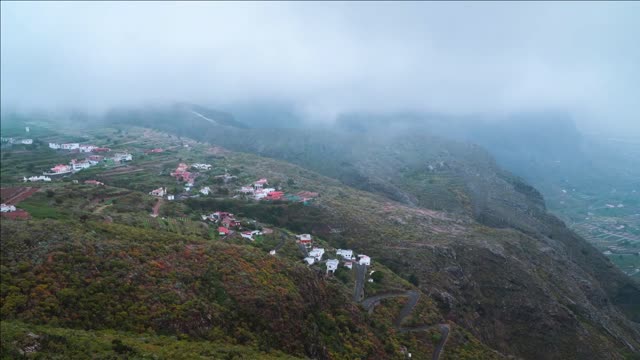 surface of the island of tenerife mountain village road low clouds canary islands spain