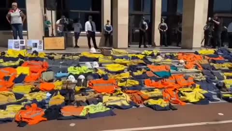 Patriots in Australia laying down their work uniforms