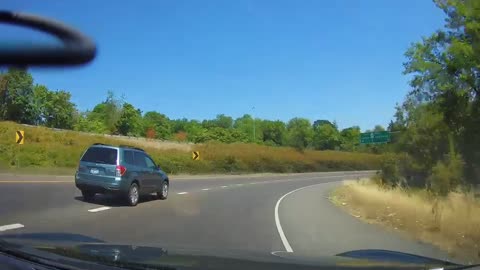 Biker's Risky Off-Ramp Pass Leads to Wipeout