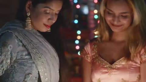 2 Beautiful Girls Lighting Up Candles