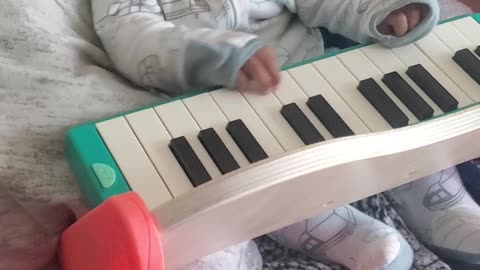 Baby plays keyboard