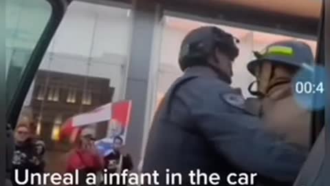 Police smash window with baby inside car