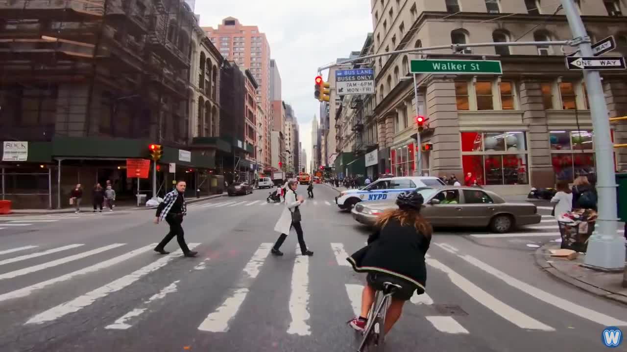 Bike Messenger Riding Fast and Fluid Through NYC Traffic