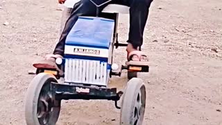 This genius kid is doing amazing tractor stunts