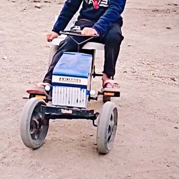 This genius kid is doing amazing tractor stunts