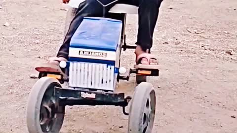 This genius kid is doing amazing tractor stunts