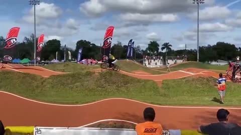 Racing Cycler Crashes Into a Flag