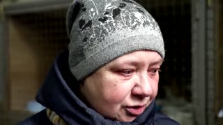 Couple bids emotional farewell to pet cat in Lviv