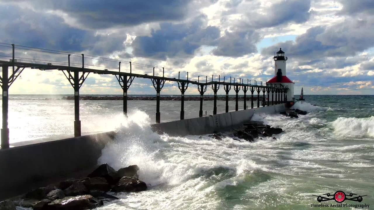 Relaxing Waves Washing Over The Lighthouse Pier 4K Drone Footage