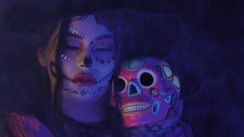 Girl disguised as a catrina in the dark