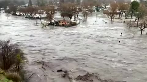 Floodwaters encircle California homes