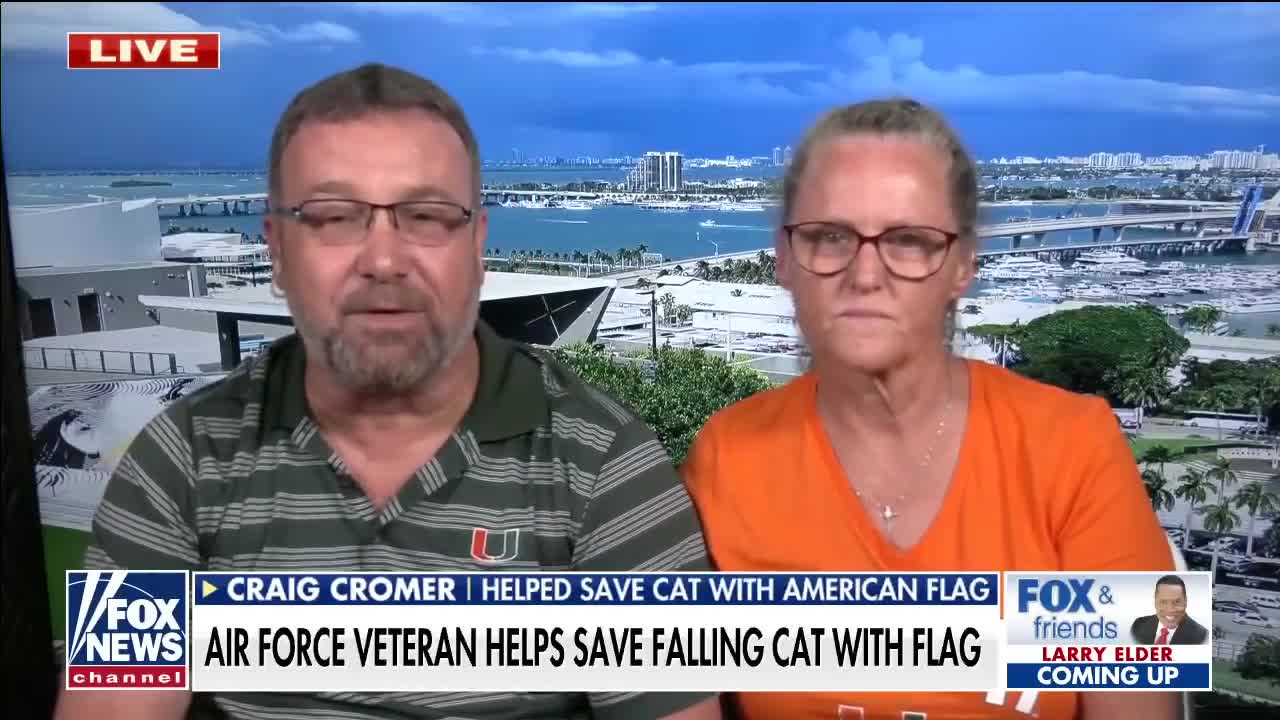 Miami couple uses American flag to catch falling cat at football game