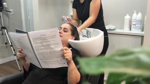 Shampooing at Salon Gets Cut Short