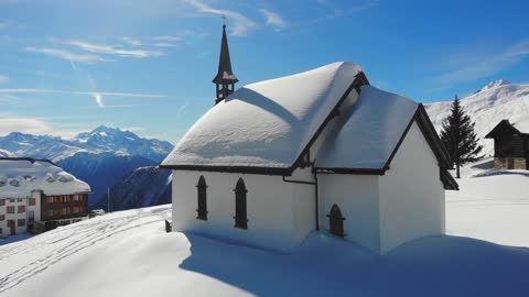 A Drone Shot of a Church in Belalp