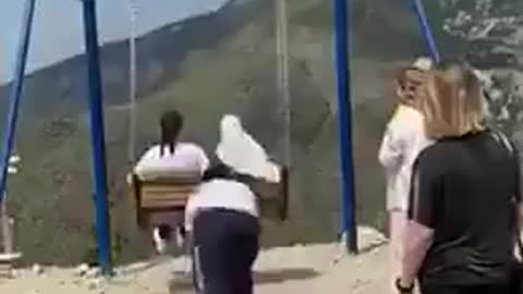 Women fall off 6300 ft cliff while taking a swing ride in viral video ||||||