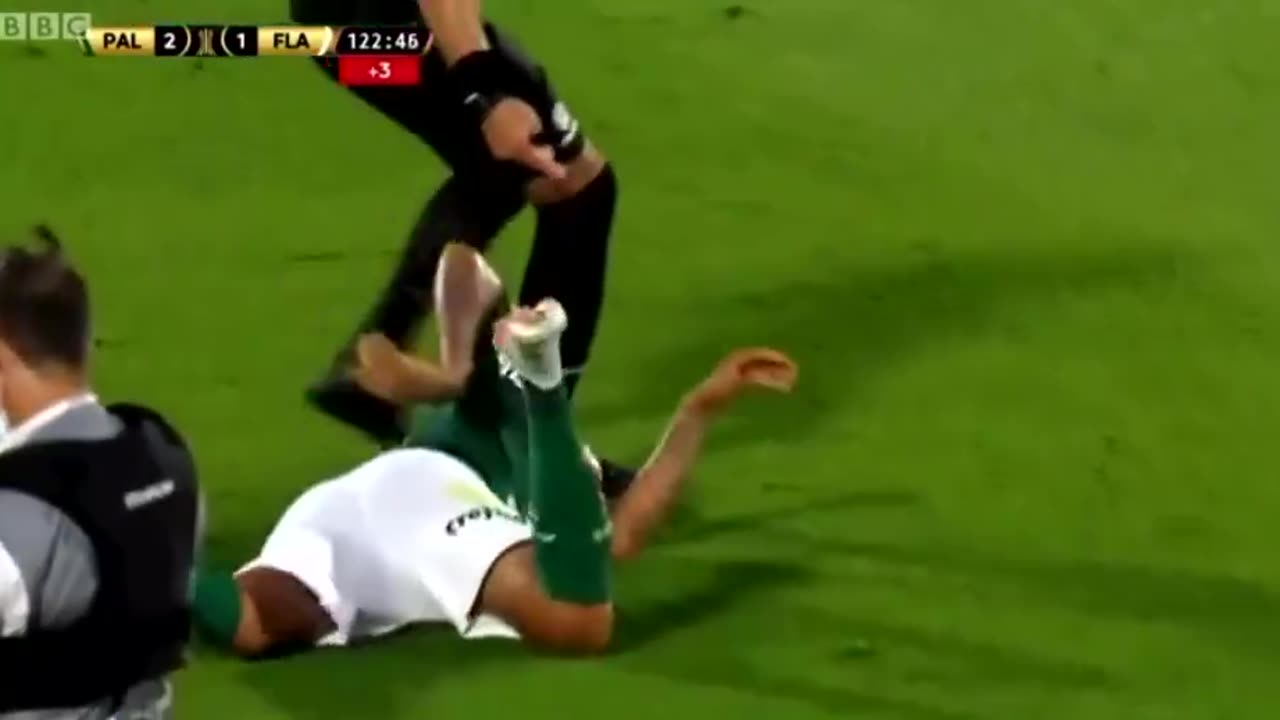 Brazilian player falls to the ground after touch from referee