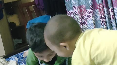 Younger brother teasing elder brother