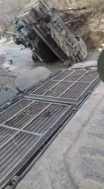Trying to Upright Flipped Russian Tank