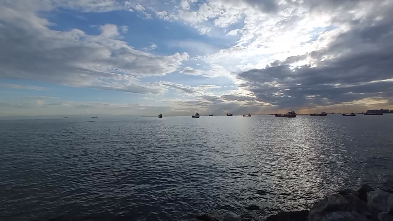 Beautiful view of clouds and sun at sea