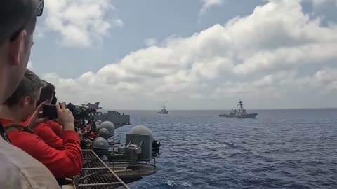 Navy F_A-18 Breaking The Sound Barrier Over Water