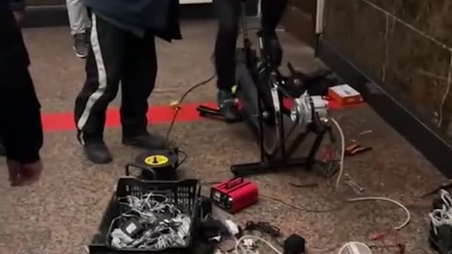 Christmas lights at a train station in Kiev, Ukraine, are powered by a bicycle.