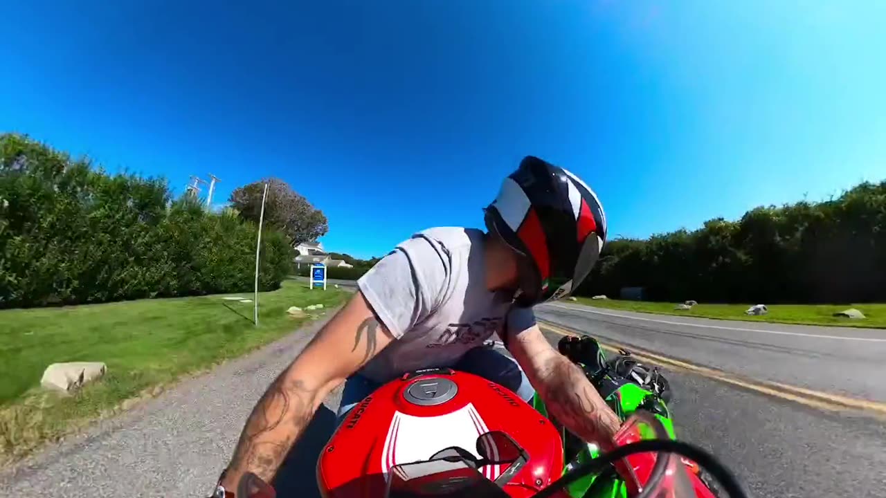 Motorcyclist Hangs On When Hit