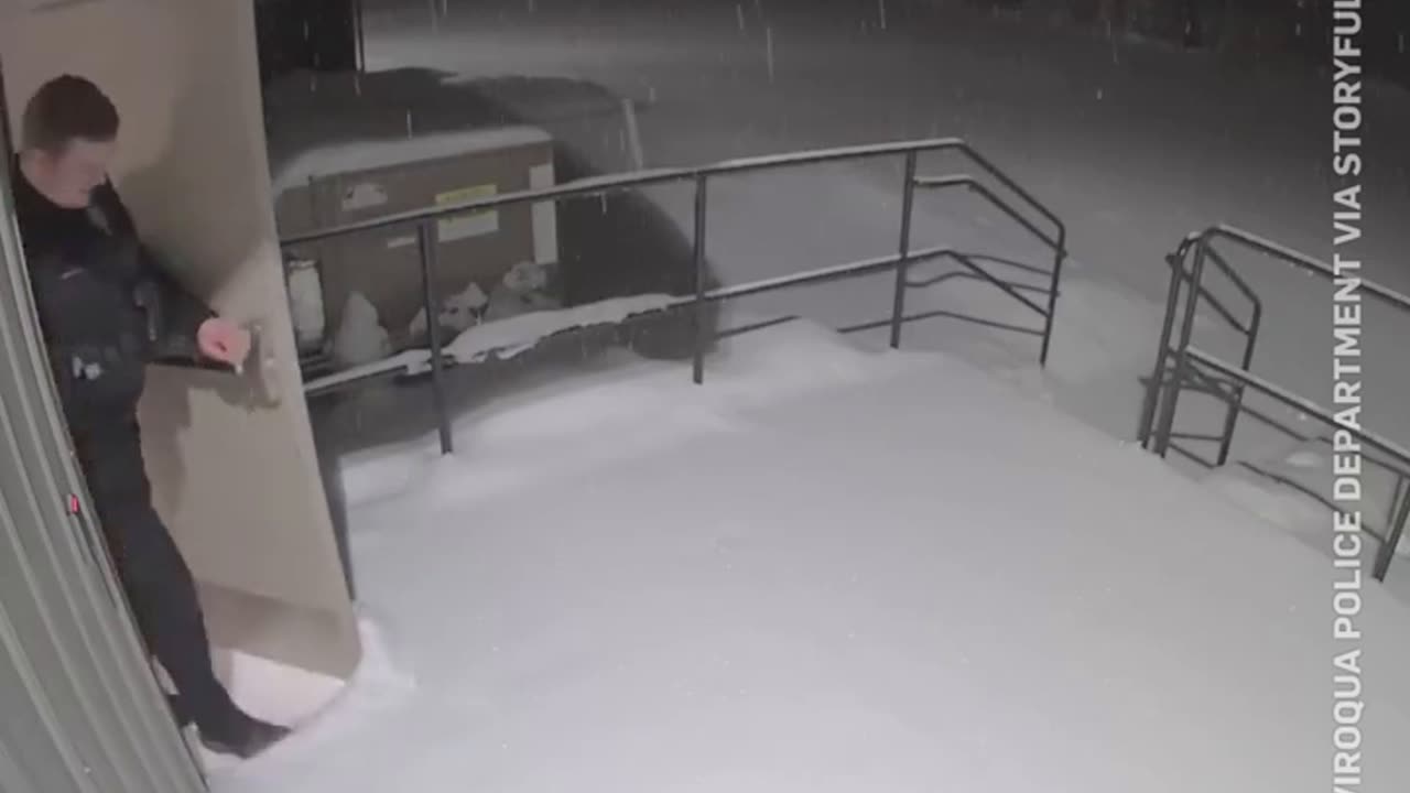 Funny moment a pile of snow drops on top of a Wisconsin officer