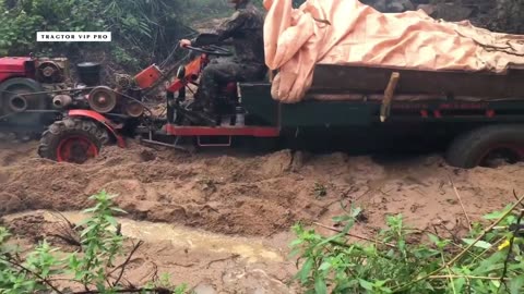Agricultural vehicle with two bridges carrying sand is muddy
