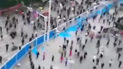 Wuhan, China, now people smash down fences