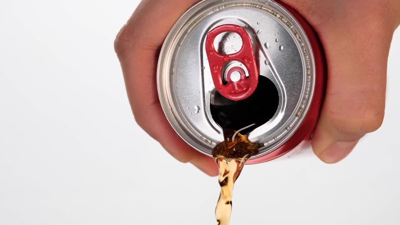 Spilling a can of cola