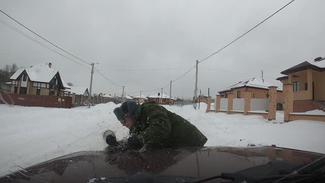 Skitching Snowboarder Veers into Wrong Lane