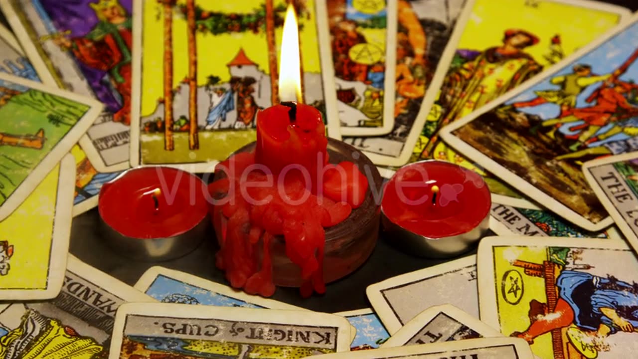 Tarot candle and red candle.