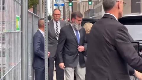 Katherine Engelbrecht and Gregg Phillips leave federal court in Houston