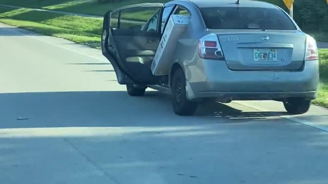 Car Transporting Large TV Has to Keep Door Open