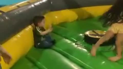 Kiddo Gets Continuously Knocked Down by Spinning Obstacle Arm