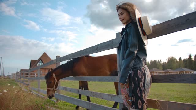 stylish lady standing near horse