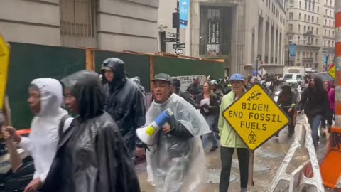 Climate Activist protest fossil fuels while wearing plastic.