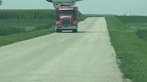 Helicopter Lands on Semi