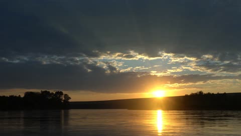 Combination of Beautiful Sun sets, Water and Sky with clouds