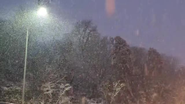 a scene of heavy snow in a car