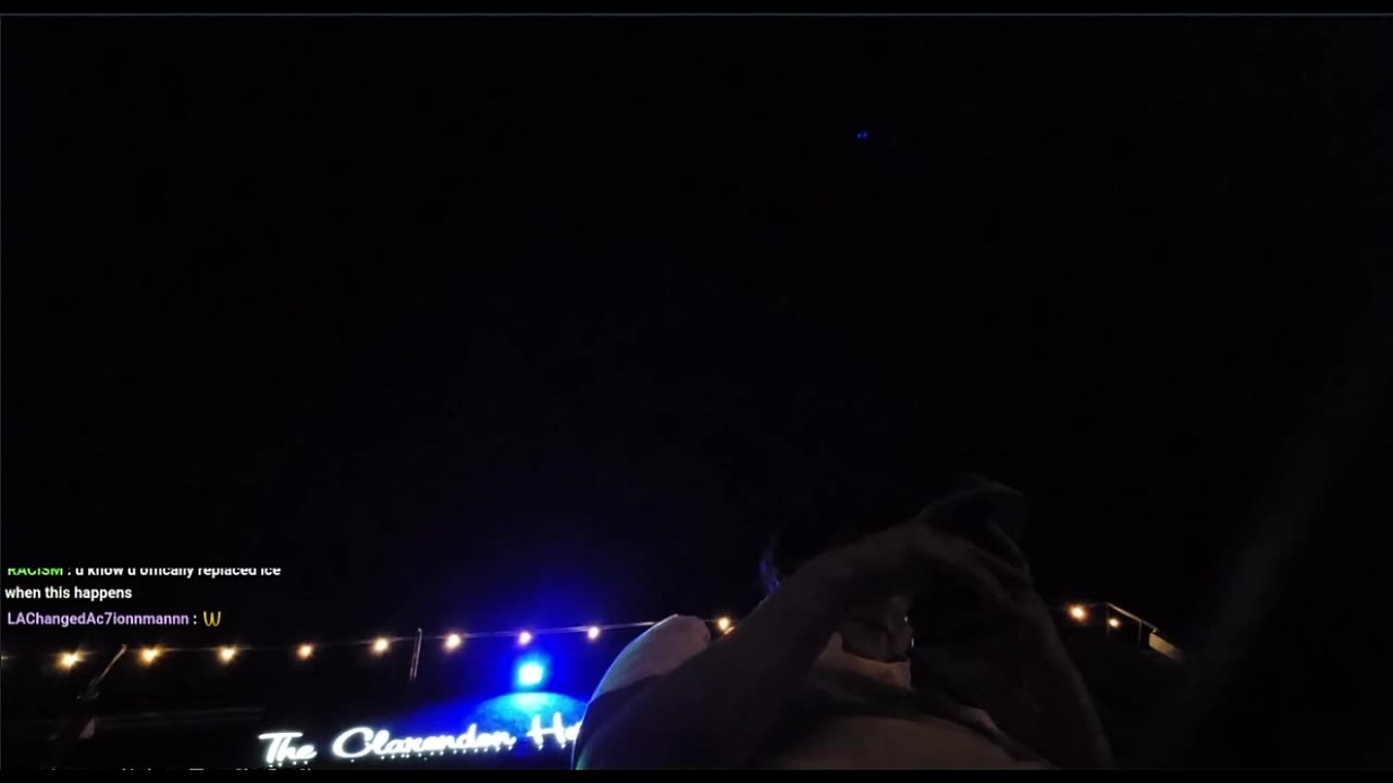 AC7 Action man outside of a hotel with a drone above his head