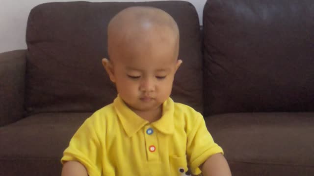 cute baby learning how to playing puzzle at home