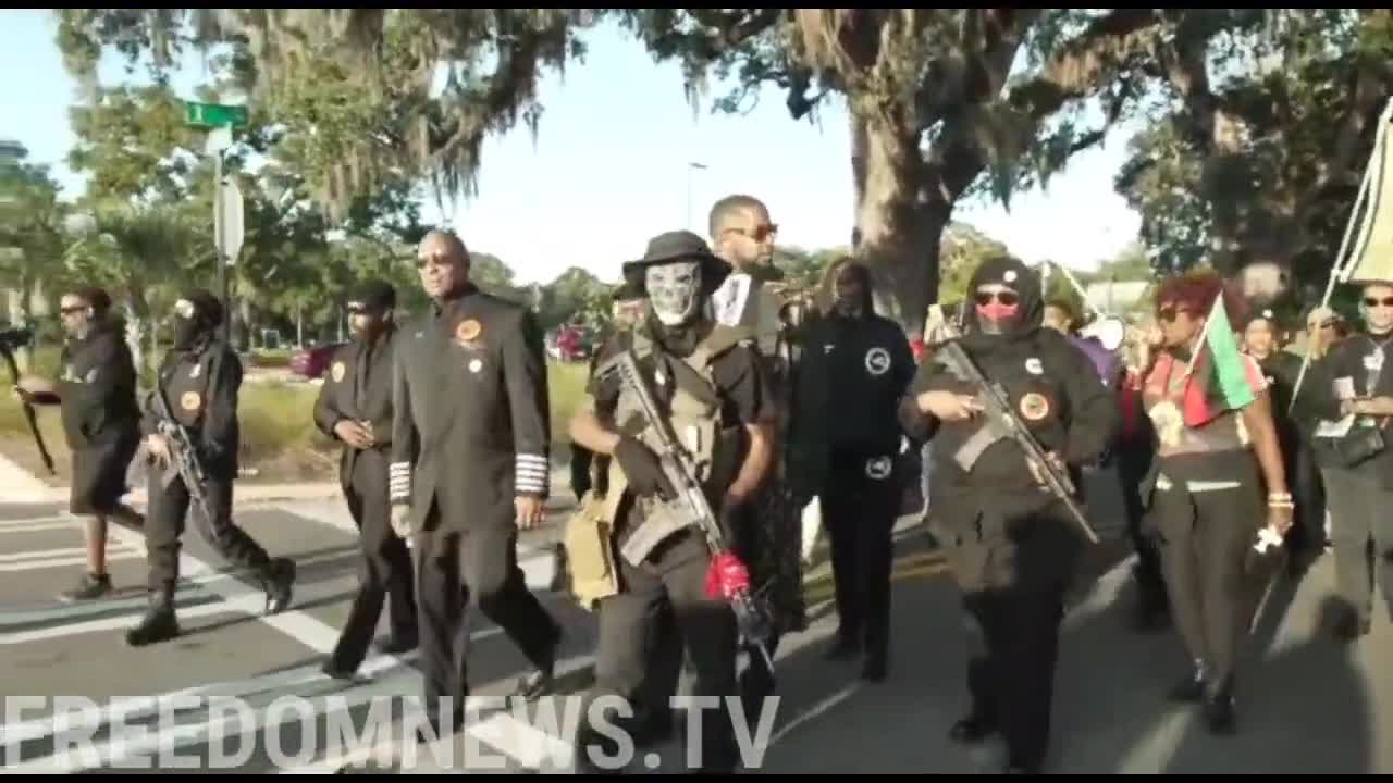 Armed Black Nationals march around Arbery courthouse